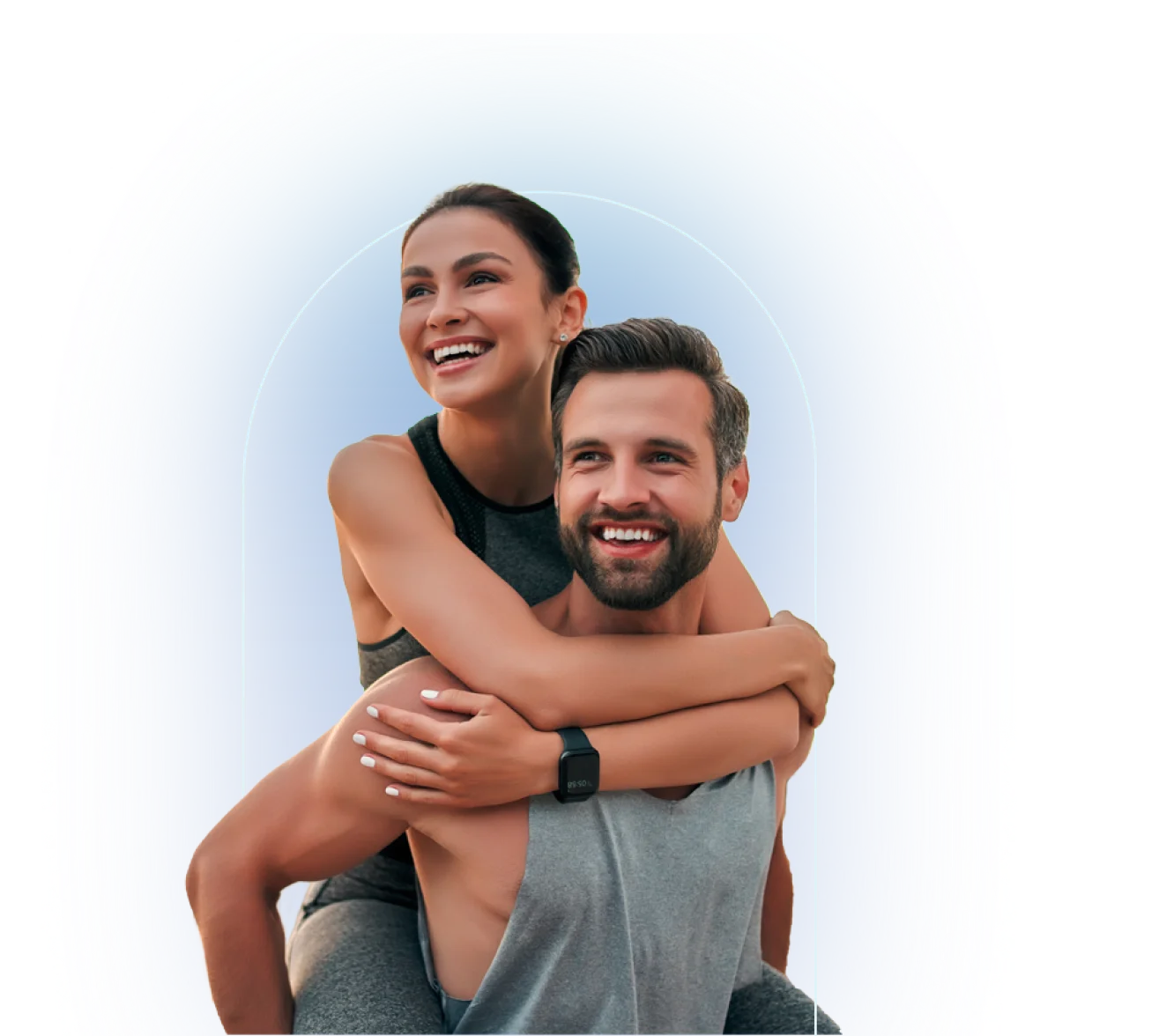 Two people in athletic wear, one wearing black tank top on other person's back, one wearing gray sleeveless top, both smiling outdoors