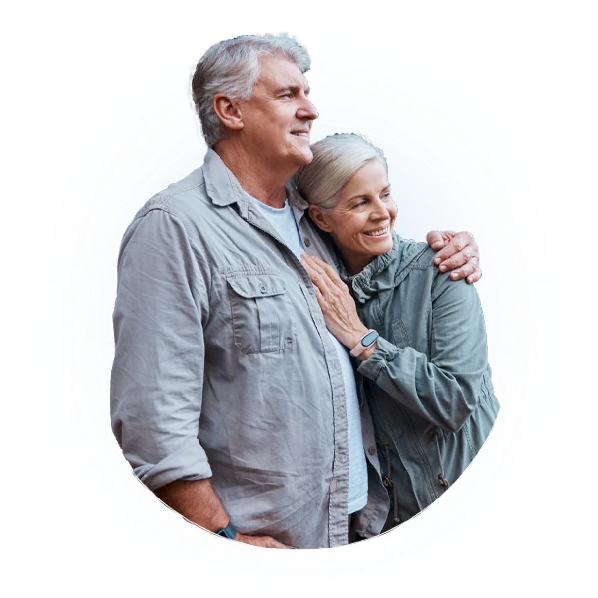 Two people stand together outdoors, one in gray button-up shirt, one in teal top