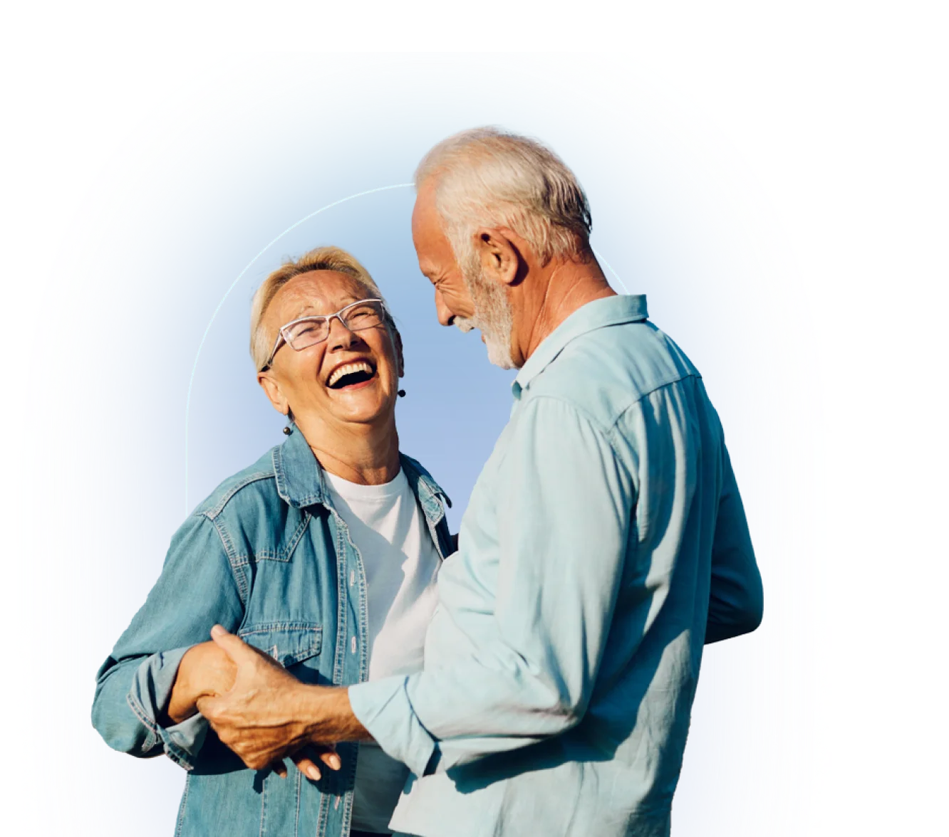 Two people stand together, one in denim button-up shirt, one in light blue polo shirt