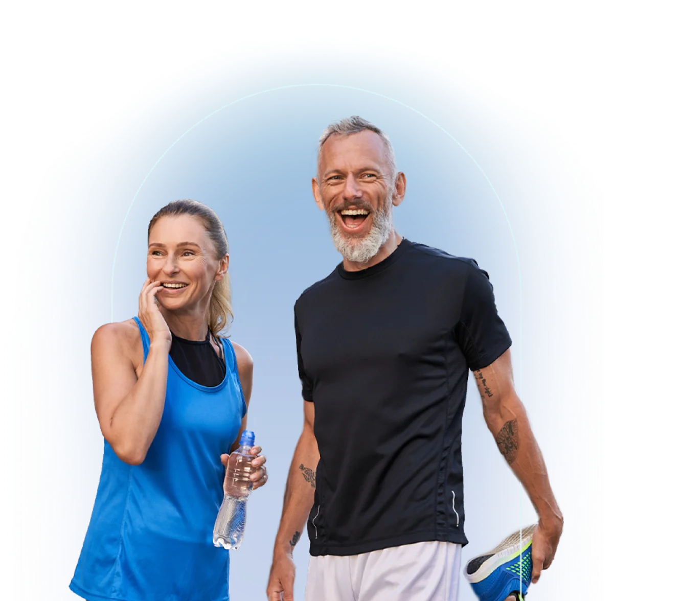 Woman in blue athletic tank top and man in black t-shirt walk side by side outdoors in athletic wear