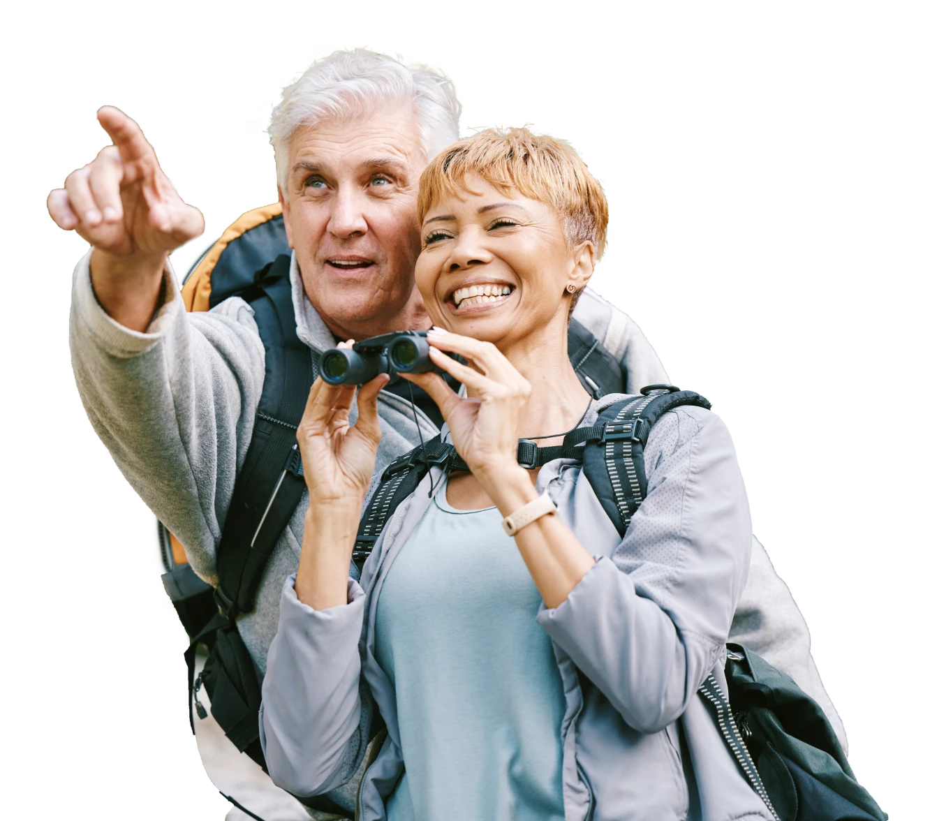 Two people outdoors wearing casual clothing and backpacks, one person pointing